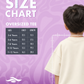 Saiba Bhogos – Premium Oversized Kids Tee (Optic Wash)